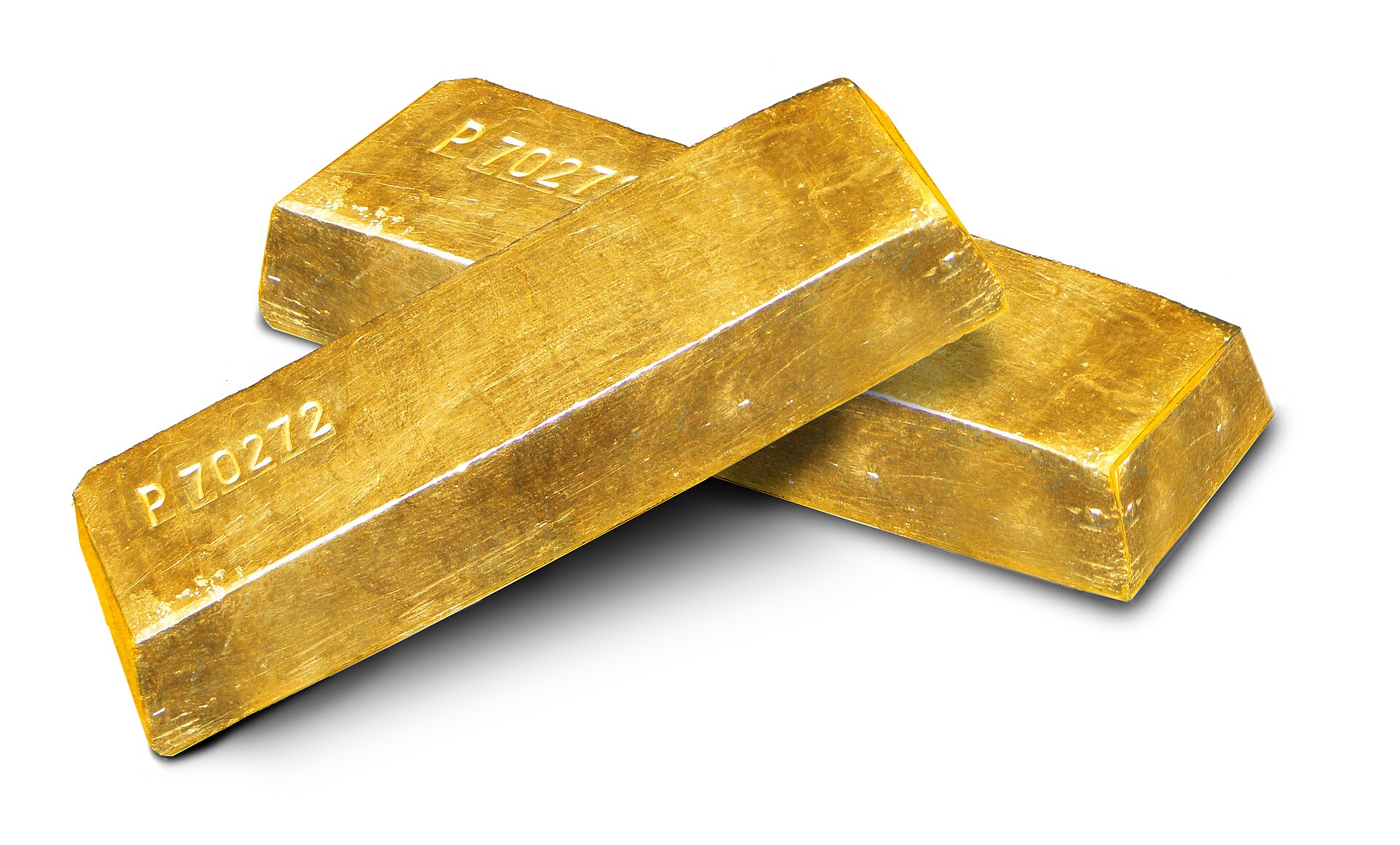 금값 트렌드와 관련된 Gold Ingots on white background.